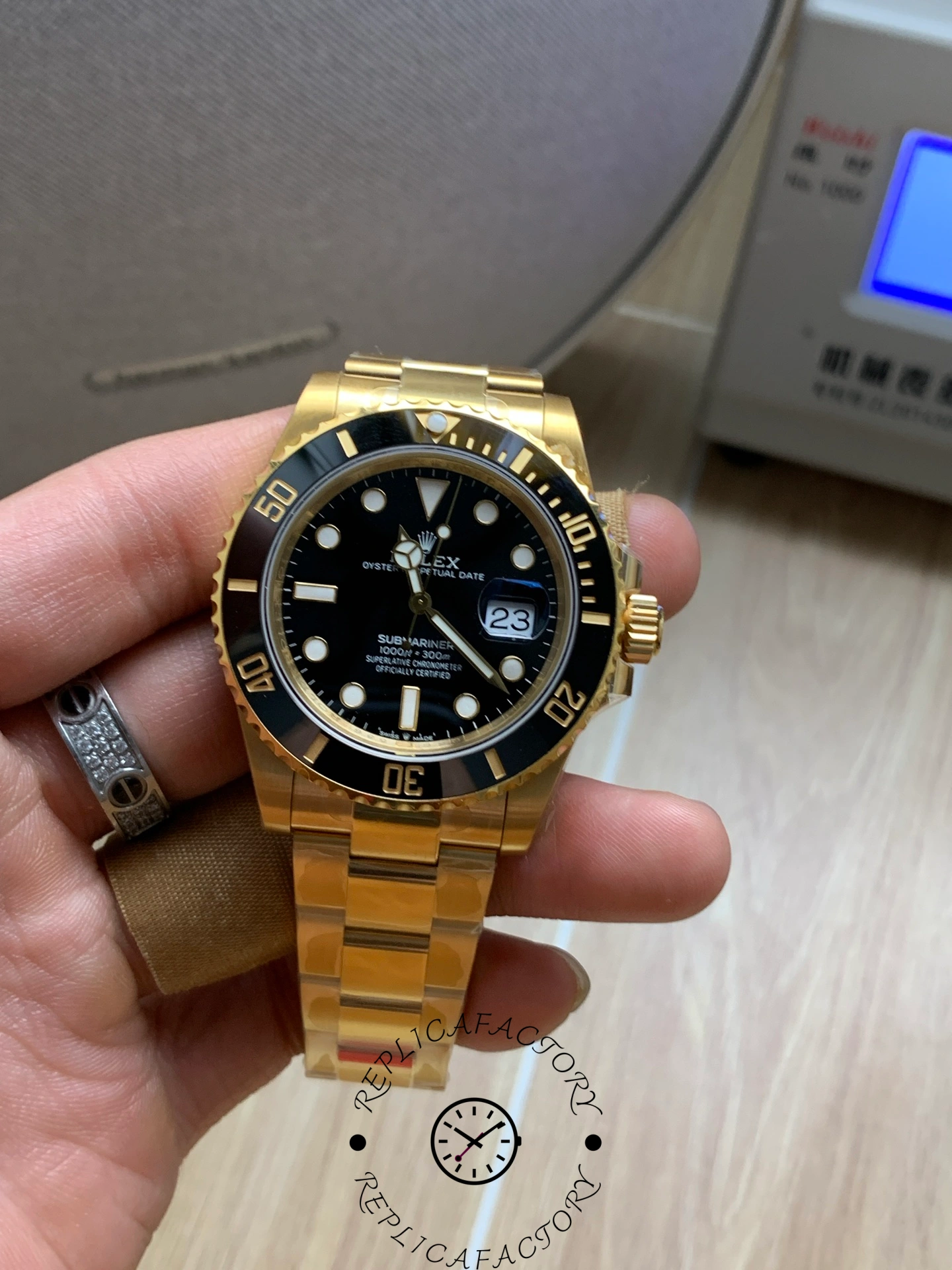 Rolex Submariner 126618LN, front view in hand showing black dial and bezel.