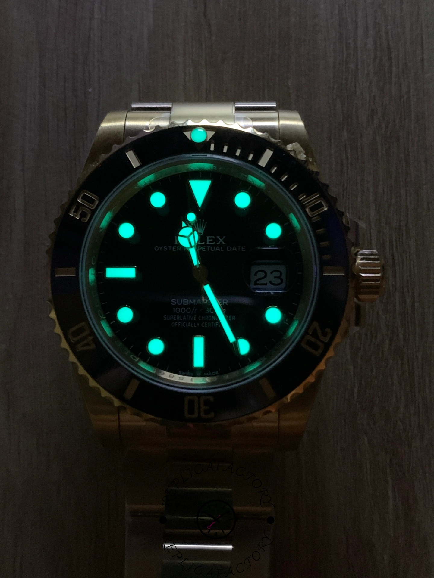 Rolex Submariner 126618LN, lume shot showing glowing hour markers.