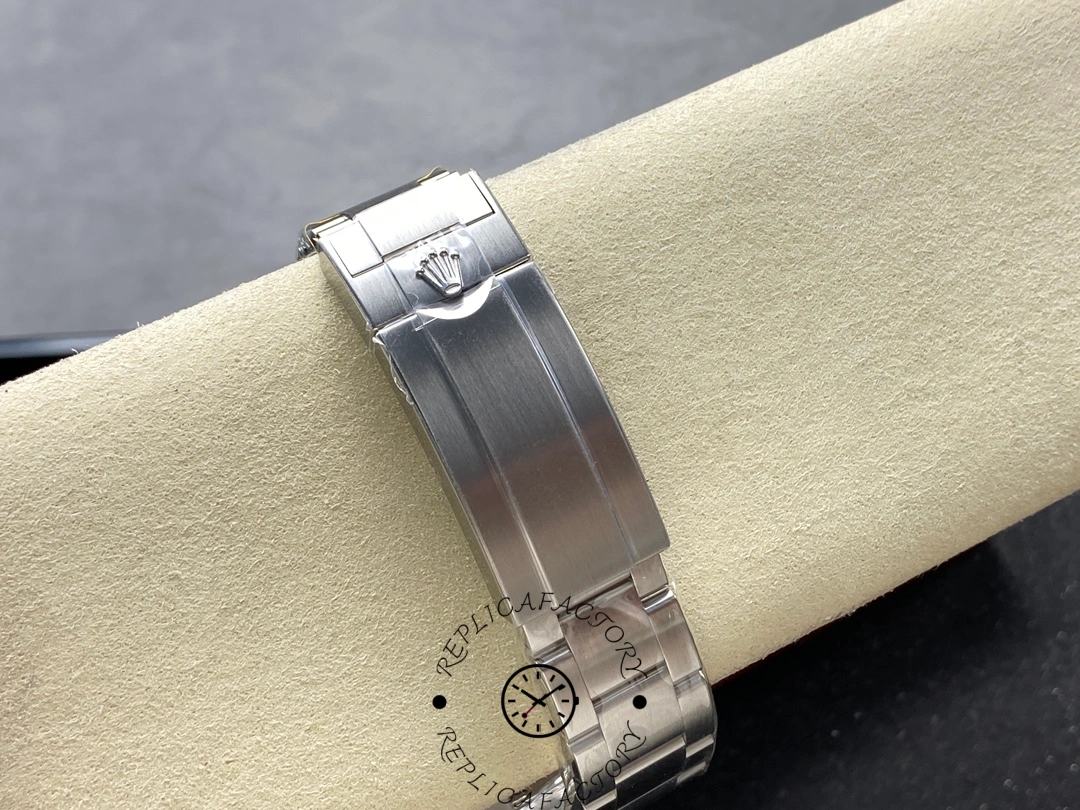 Rolex Submariner 126619LB 0003, clasp and bracelet detail on cushion.
