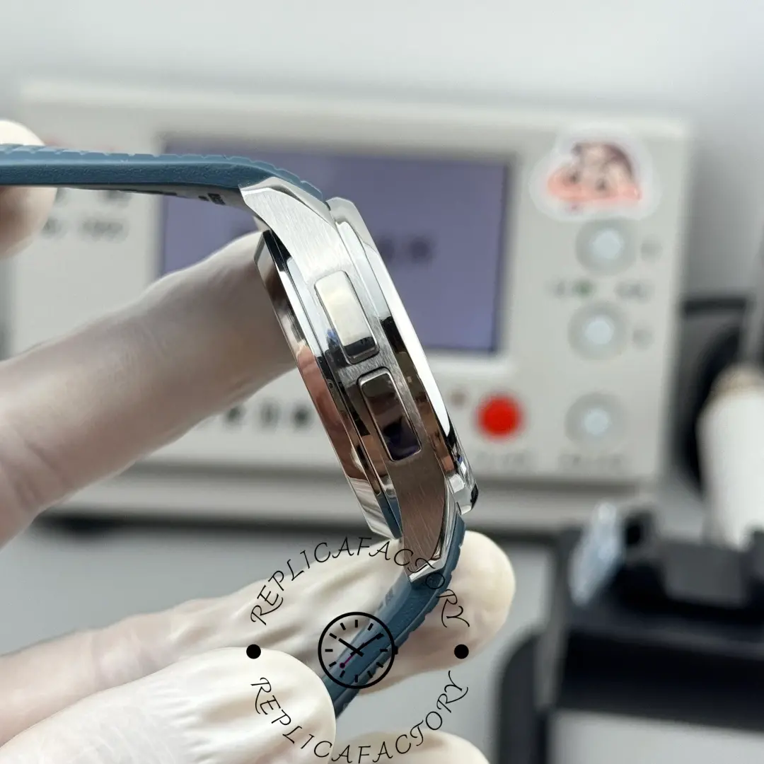 Another side angle of Patek Philippe Aquanaut 5164G-001 highlighting polished bezel and lug curve.