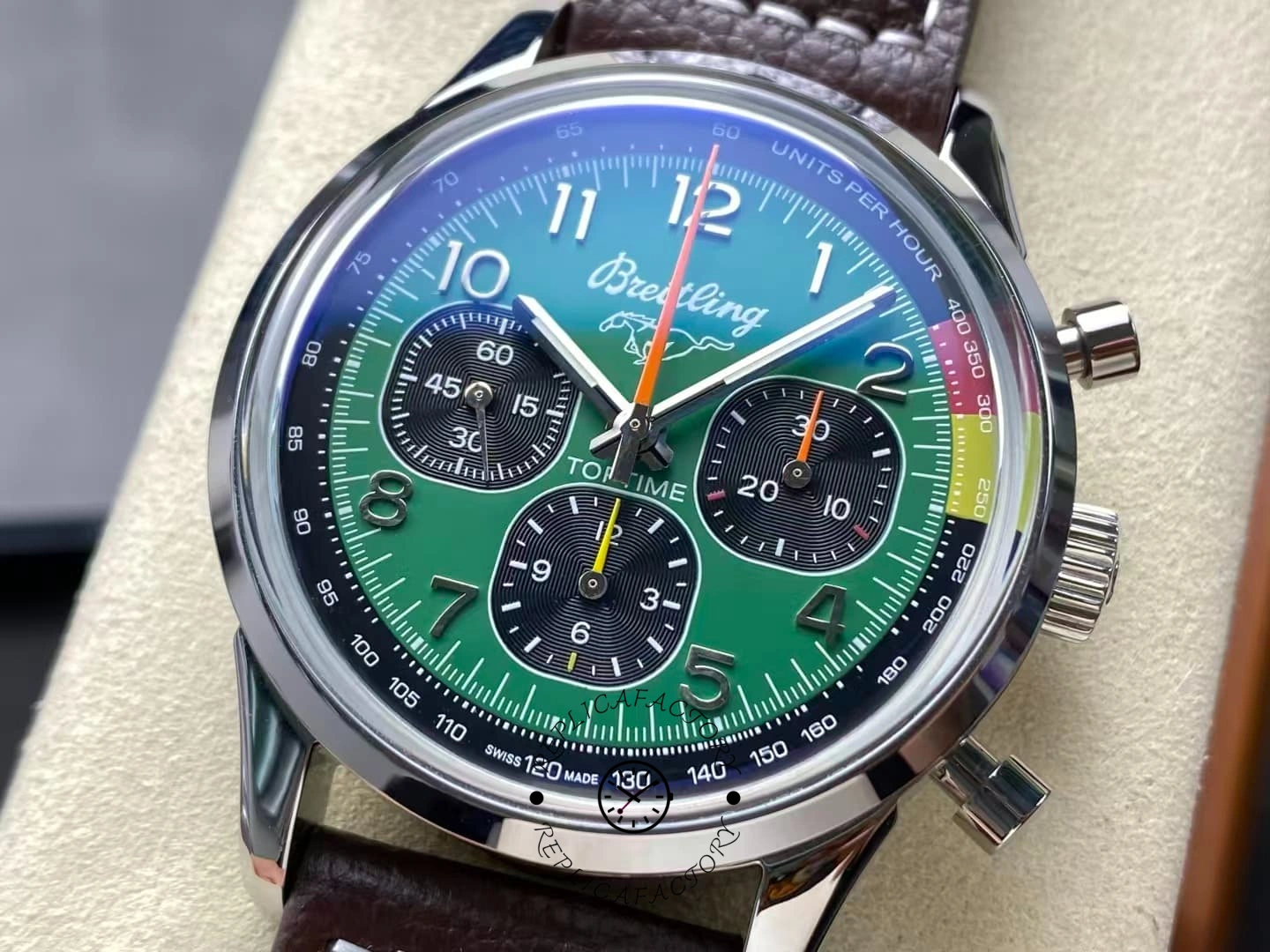 Close-up of Breitling Top Time B01 AB01762A1L1X1 highlighting green dial texture and tachymeter bezel.