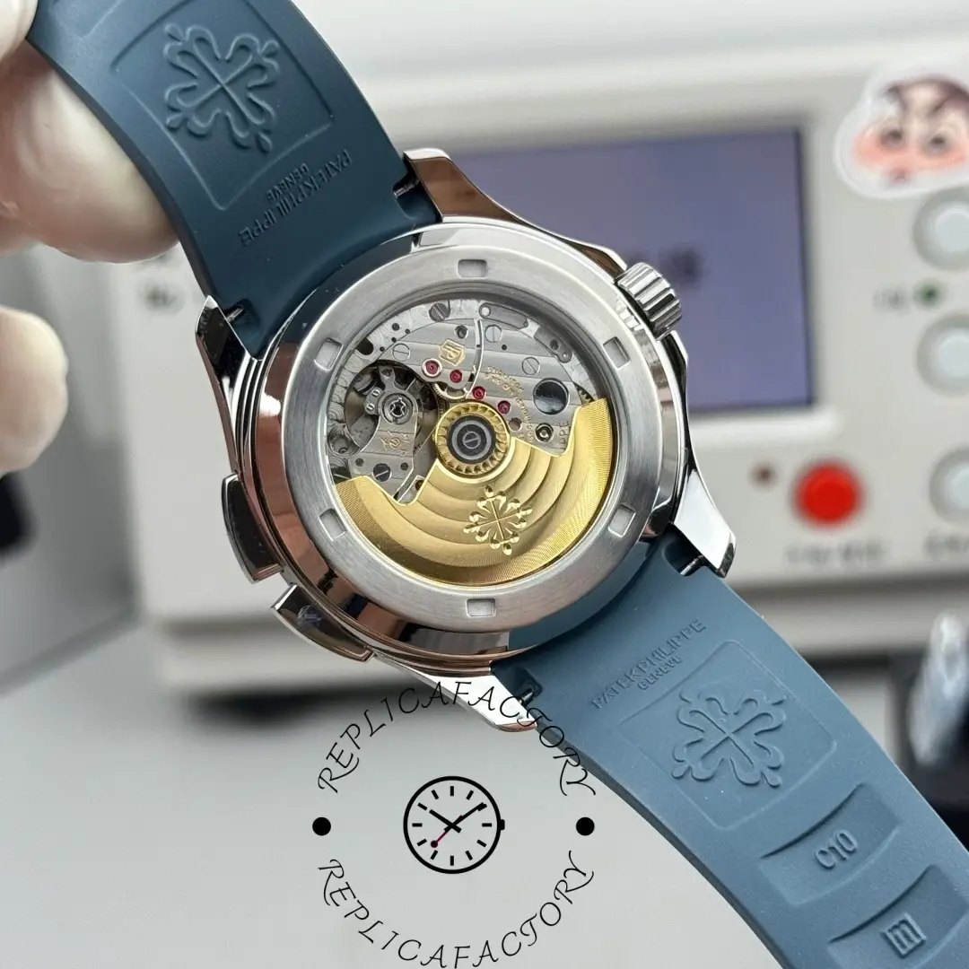 Caseback angle of Patek Philippe Aquanaut 5164G-001 showing gold rotor and strap attachment.