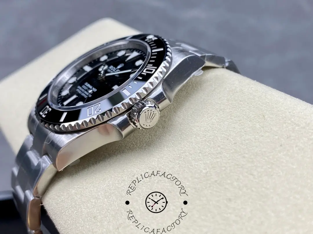 Rolex Submariner 124060, side view on cushion showing crown, bezel and crystal.