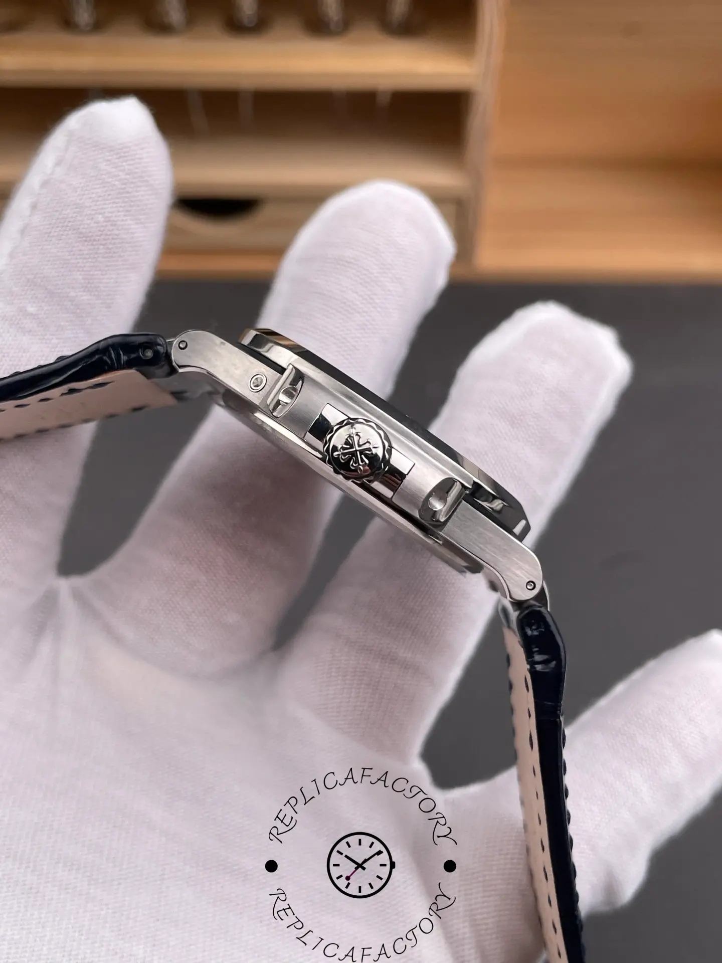 Side profile of Patek Philippe Nautilus 5724G-001 showing case edge and crown guards.