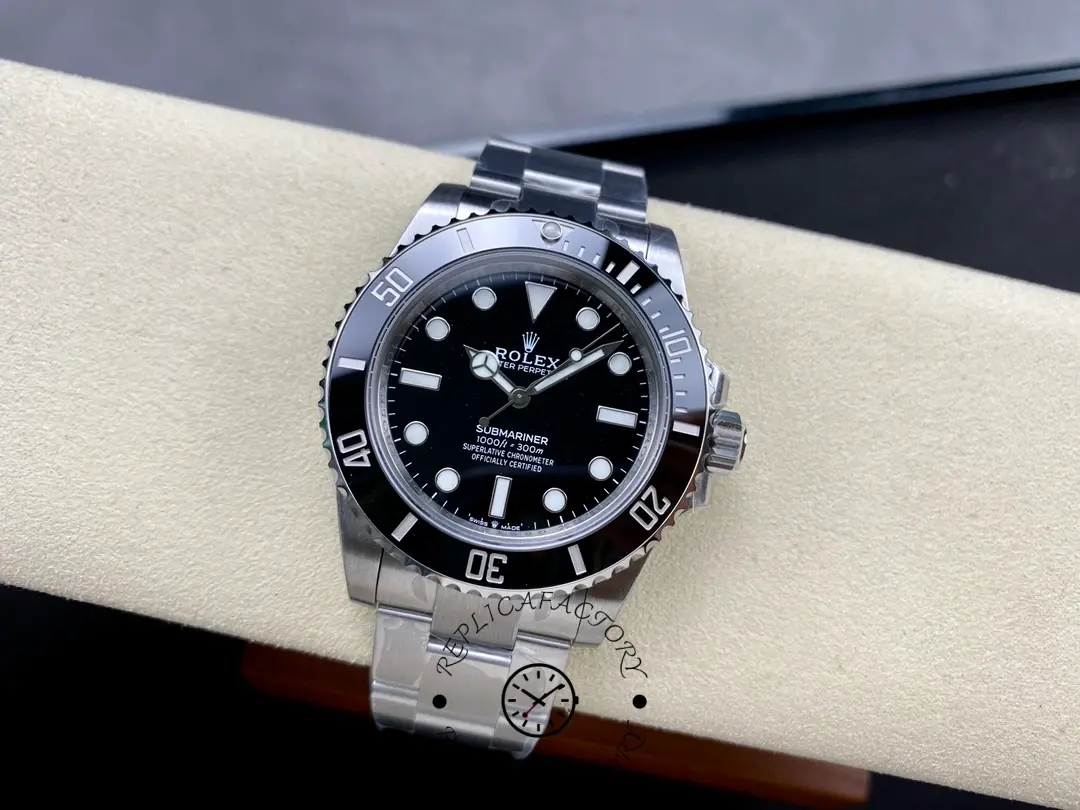 Rolex Submariner 124060, full watch on cushion, Oyster bracelet.