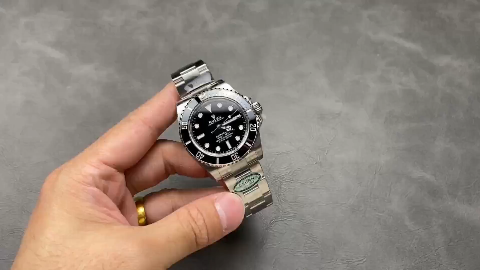 Rolex Submariner 124060, video showing watch held in hand. - Video