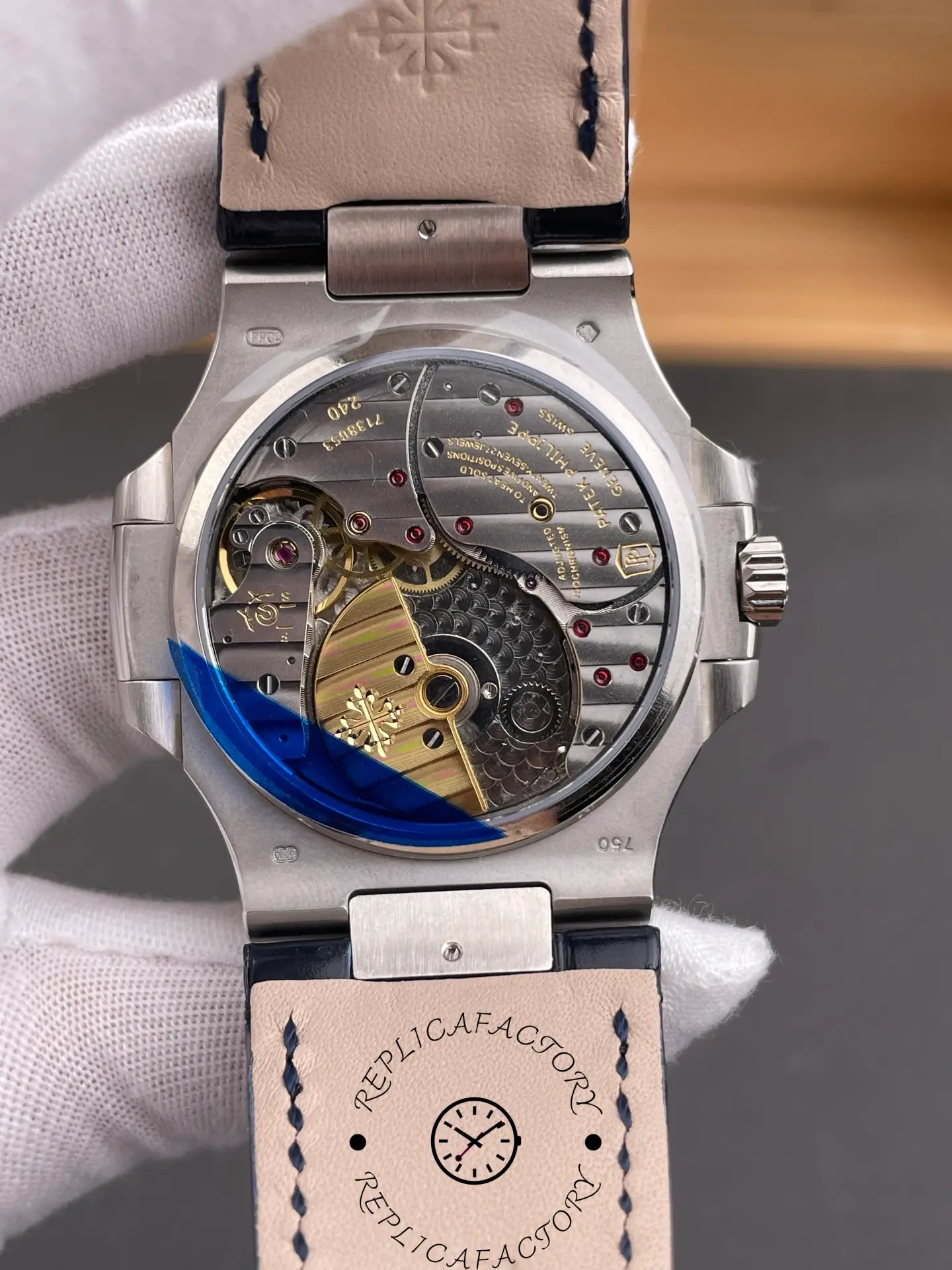 Caseback angle of Patek Philippe Nautilus 5724G-001 showing rotor engraving through sapphire back.