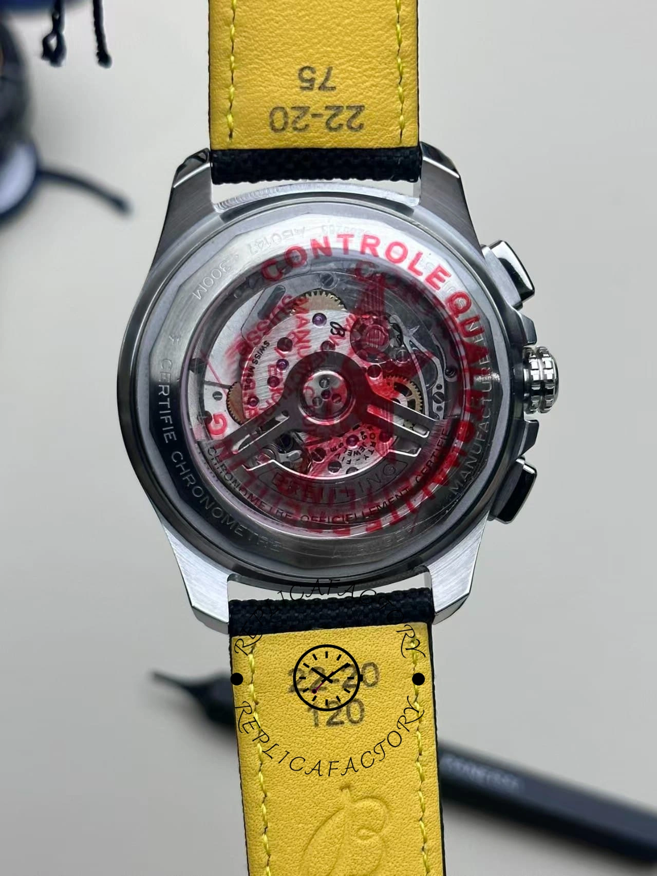 Macro case back of Breitling Avenger B01 AB0146101B1X1 showing rotor and engraving details.