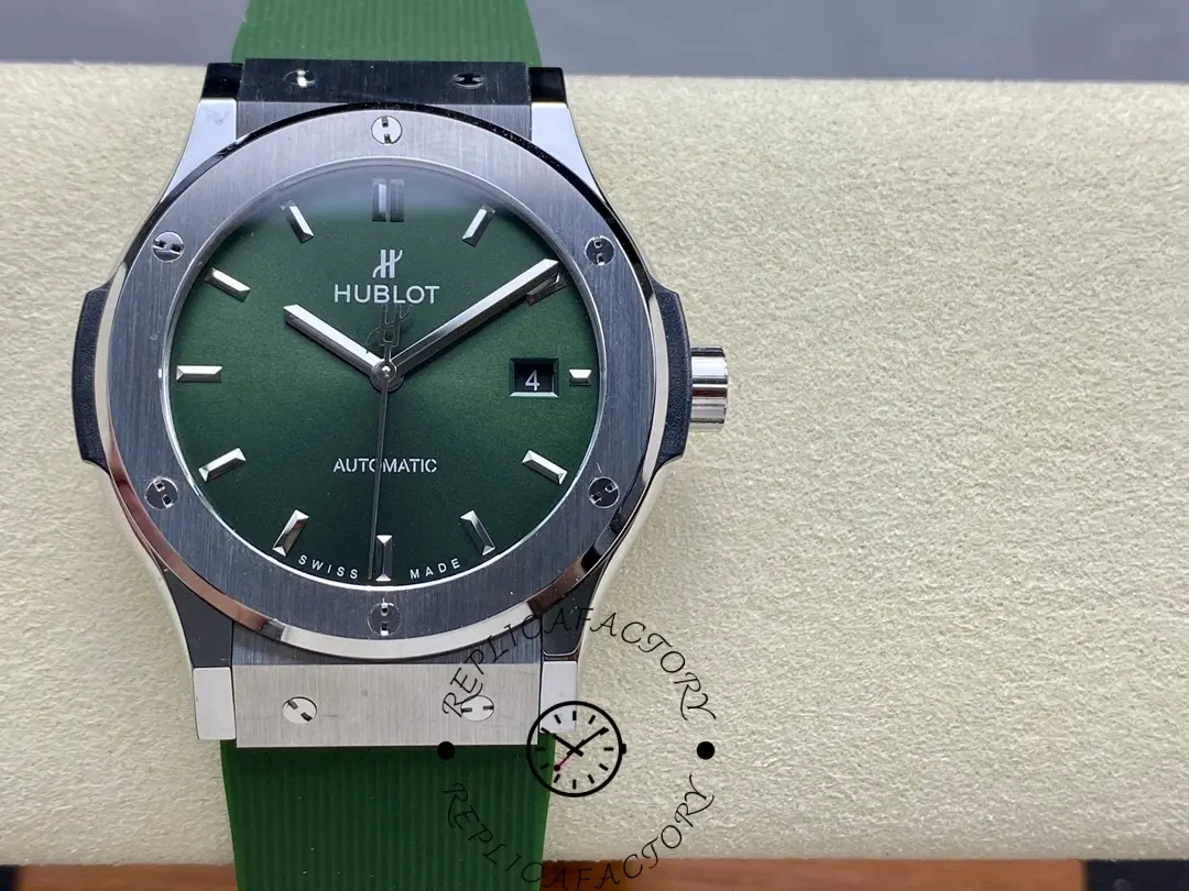 Hublot Classic Fusion 542.NX.8970.RX on display cushion, full watch front with green dial, 42mm case.