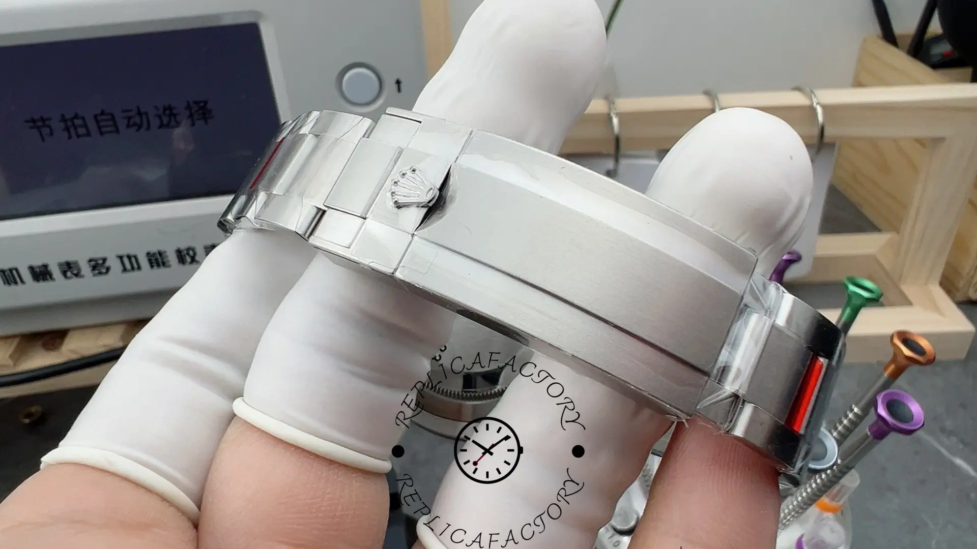 Rolex Submariner 126610LV, close-up of clasp area with protective film on bracelet.