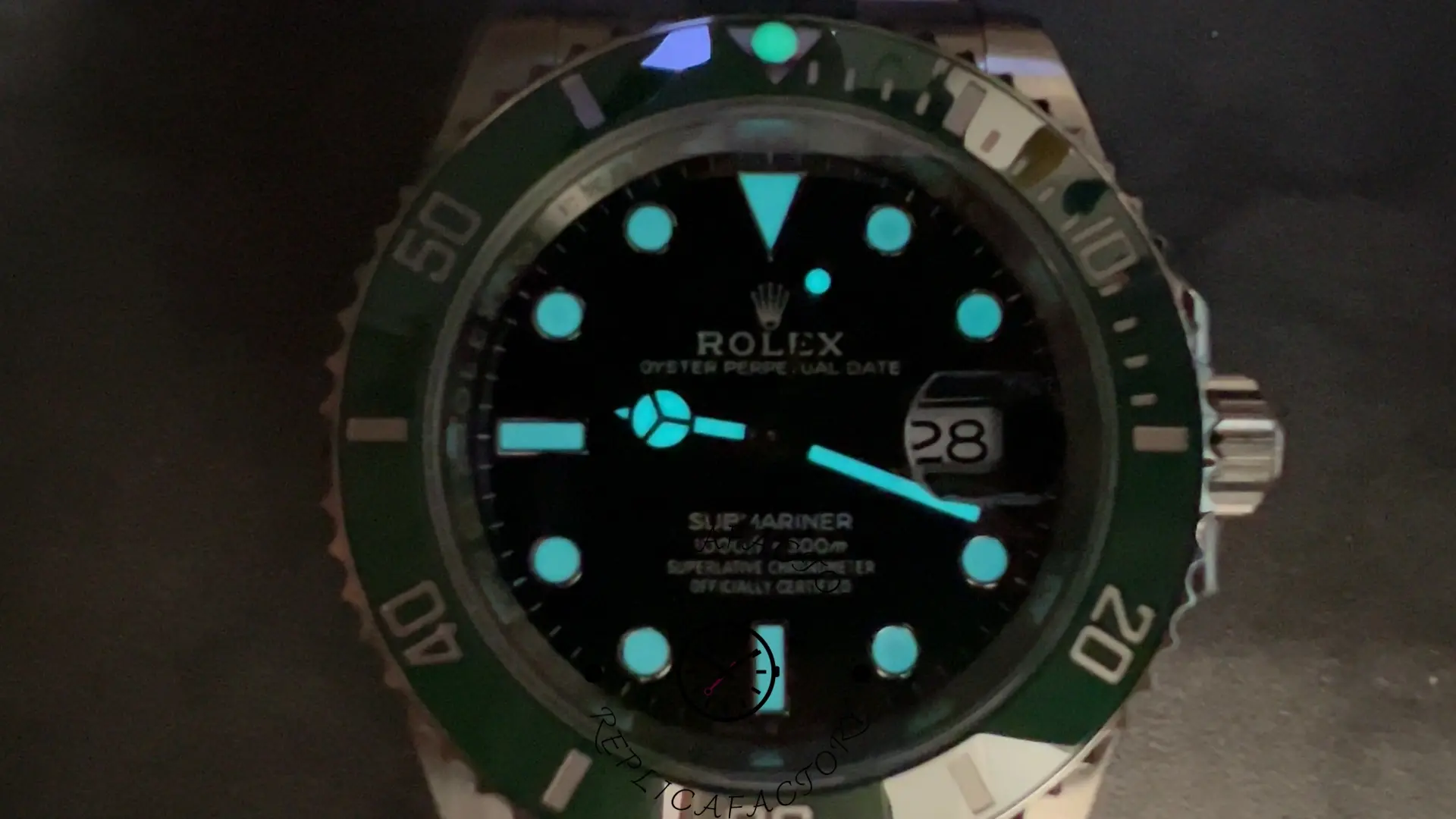 Rolex Submariner 126610LV, lume shot in darkness showing glowing hands and markers.