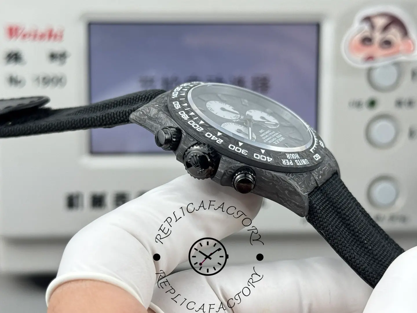 Replica Rolex DiW Daytona All Carbon Graphite 40mm, close-up of crown and chronograph pushers on case side.