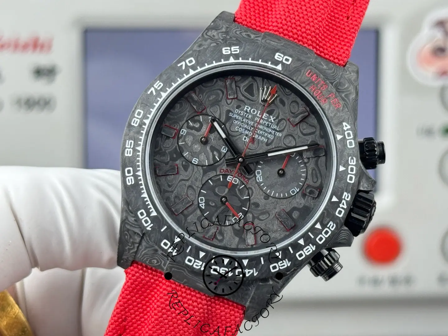 Rolex DIW Daytona NTPT Carbon 40mm, macro dial view focusing on the chronograph registers and hands.