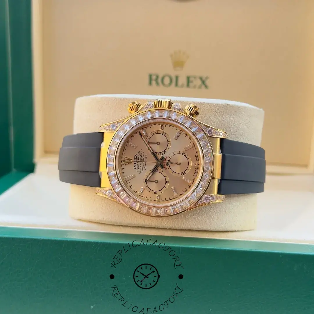 Rolex Daytona 126538TBR display shot in box, showing gold dial and black Oysterflex strap.