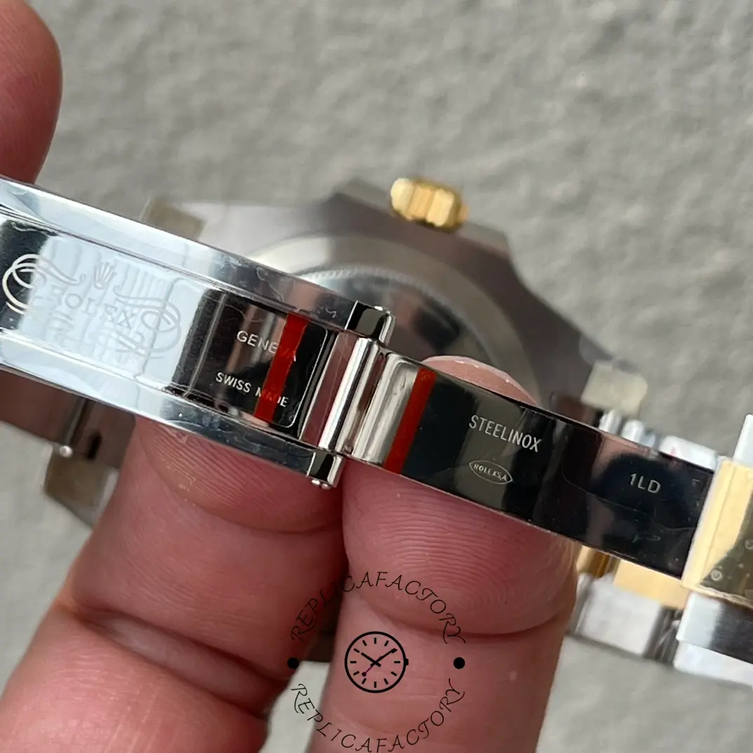 Rolex Submariner Date 116613, clasp and bracelet view held in hand.