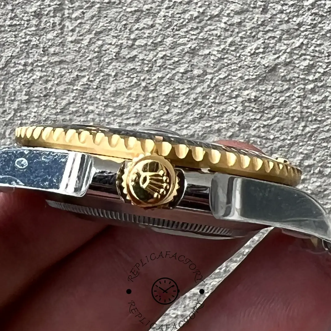 Rolex Submariner Date 116613, side view showing gold crown and bezel teeth.
