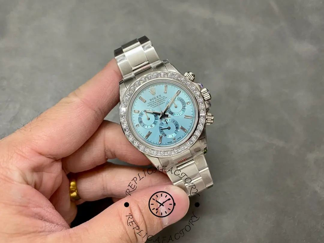 Rolex Daytona 116576TBR, full watch in hand showing ice blue dial and complete Oyster bracelet length.