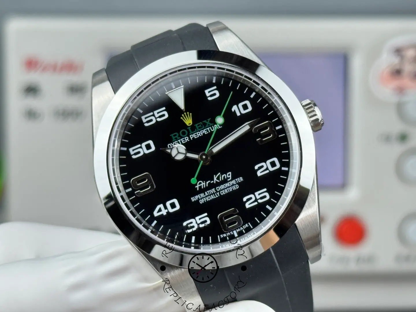 Rolex Air-King 126900 0001, black dial close-up, minute scale and green Rolex text.