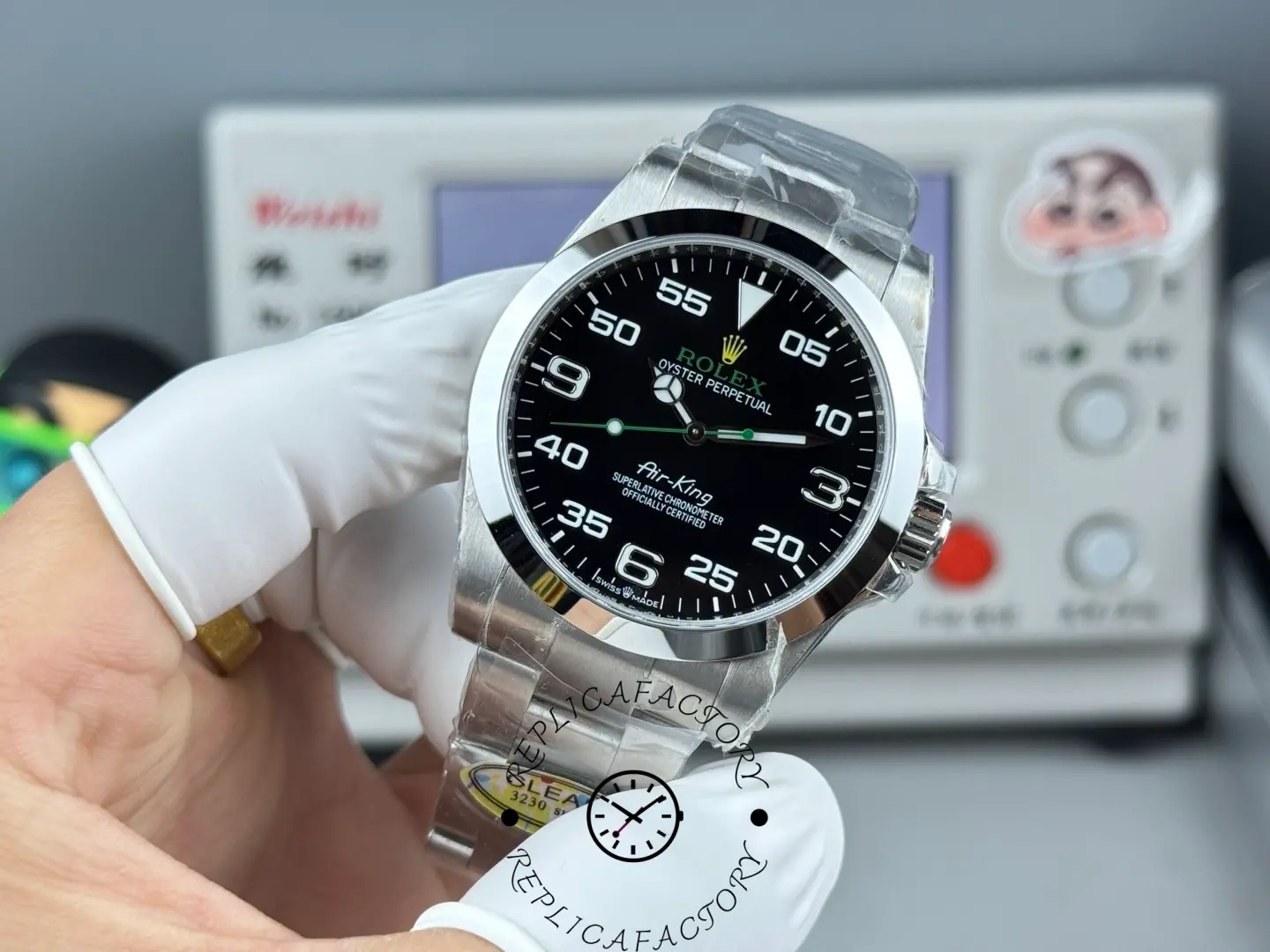 Rolex Air-King 126900 0001, front view in hand, showing 3 o’clock date window and markers.