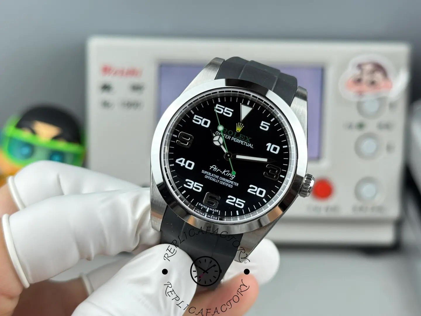 Rolex Air-King 126900 0001 angled view, black dial, rubber strap.