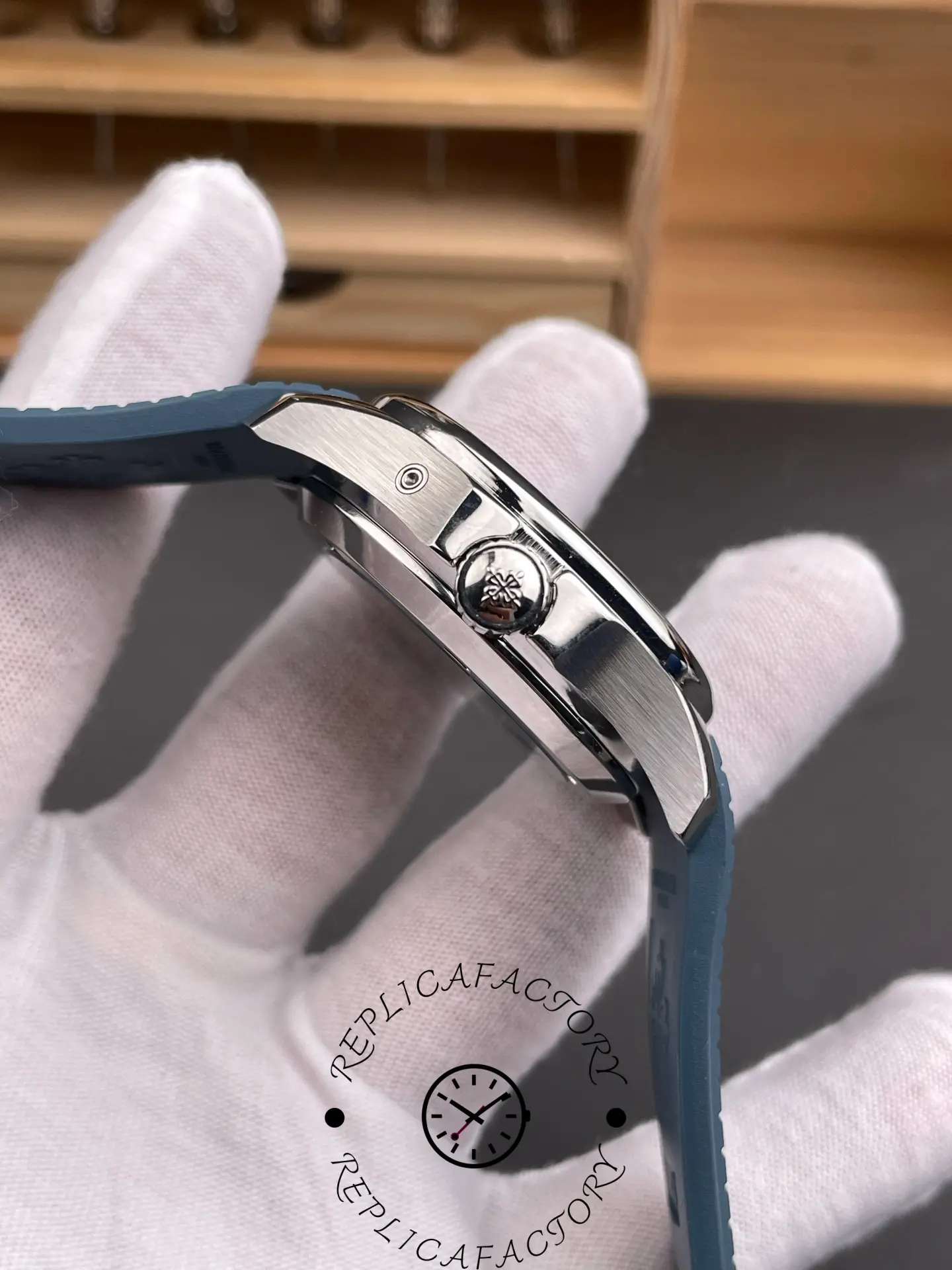 Side profile of Patek Philippe Aquanaut 5164G-001 showing slim case, crown, and strap fit.