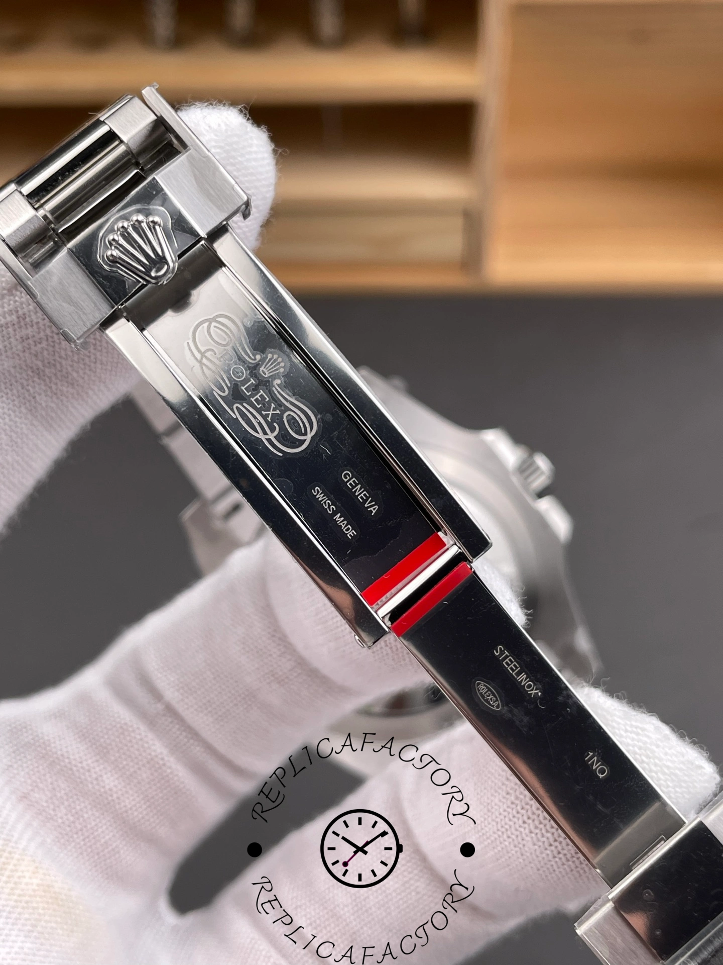 Rolex GMT-Master II 126710BLNR 0003 clasp close-up, engraving detail on Oyster clasp, in glove.