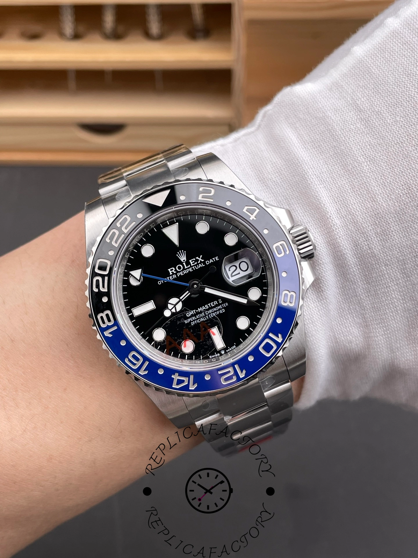 Rolex GMT-Master II 126710BLNR 0003 on wrist, black dial and blue-black bezel, front view.