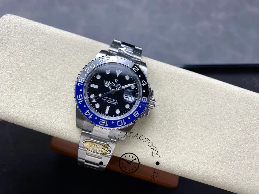Rolex GMT-Master II 126710BLNR 0003 on cushion, angled top view of black dial and bezel.