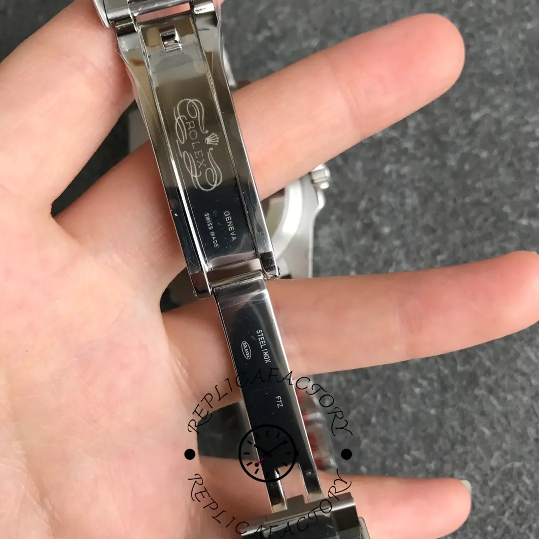 Rolex GMT-Master II Batman 116710BLNR clasp interior view, safety lock and hinge details.