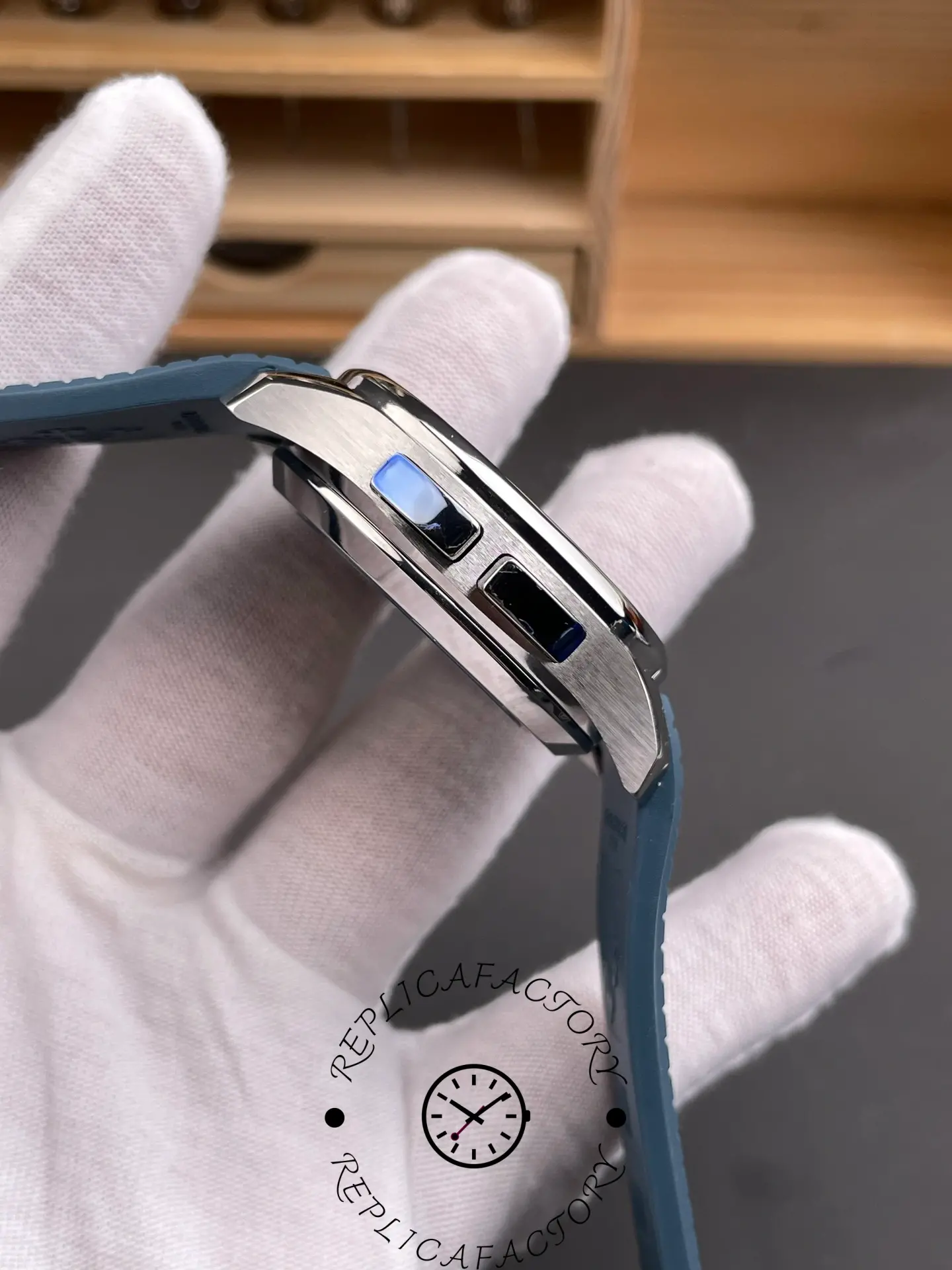 Low side view of Patek Philippe Aquanaut 5164G-001 highlighting bezel height and curved lugs.