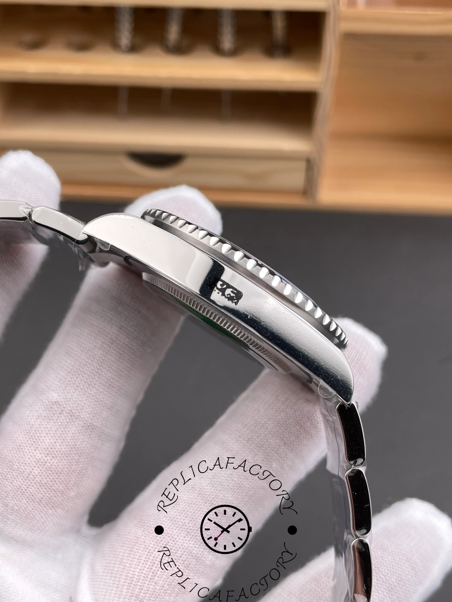 Rolex GMT-Master II 126710BLNR 0003 bracelet side view, case and end links, in glove.