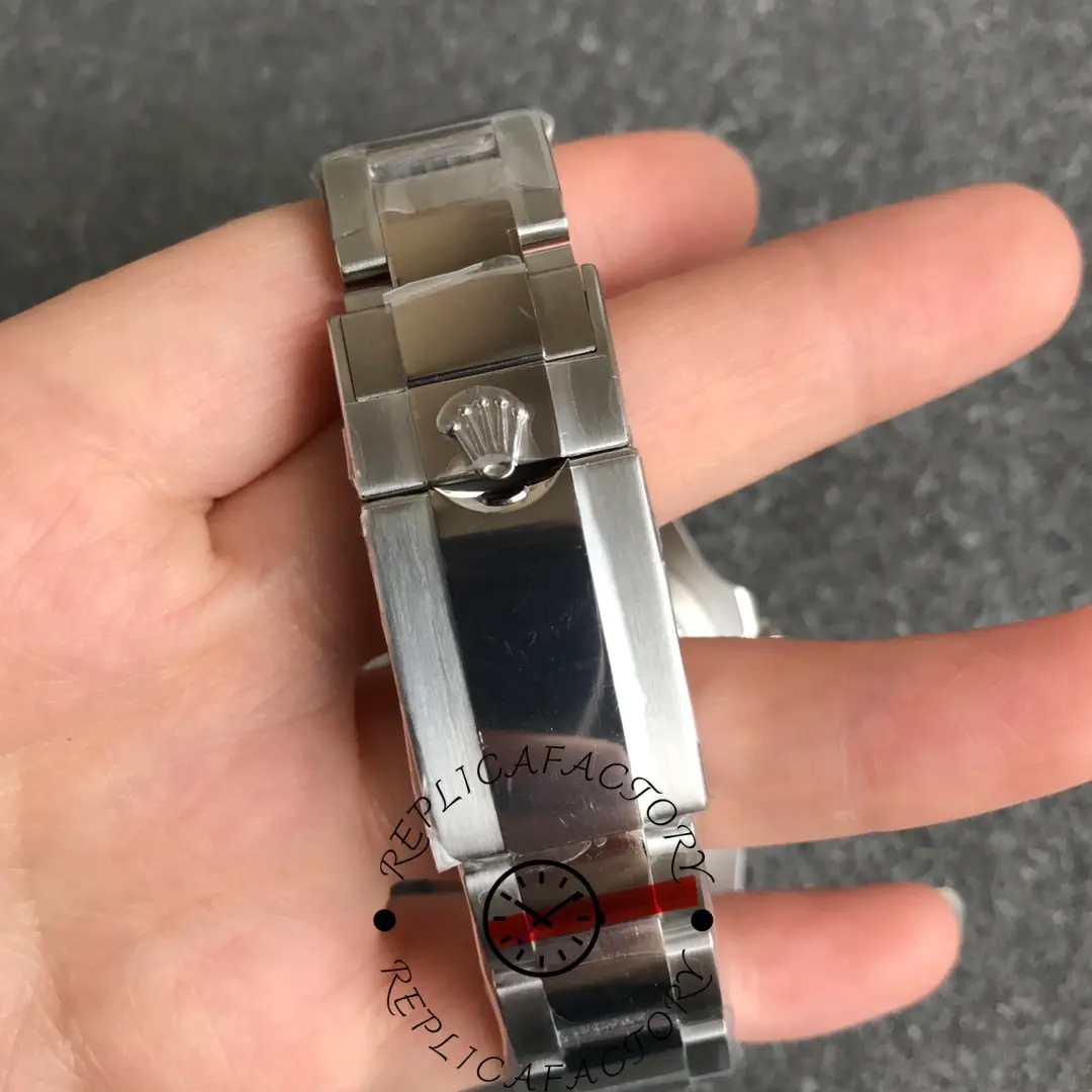 Rolex GMT-Master II Batman 116710BLNR clasp detail, folding clasp in hand.