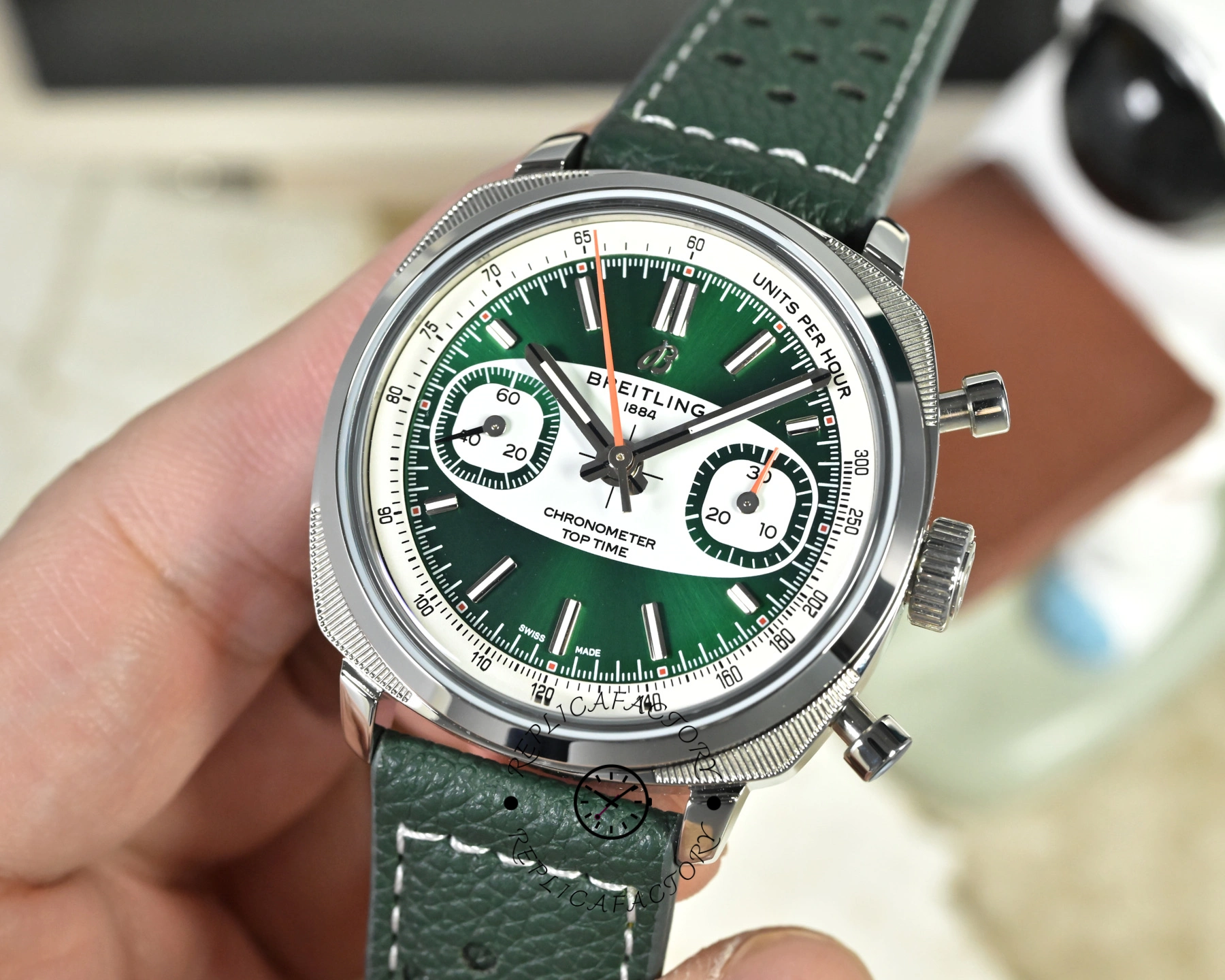 AB01771A1L1X1 angled wrist shot, showing green dial, chronograph subdials, and polished case.