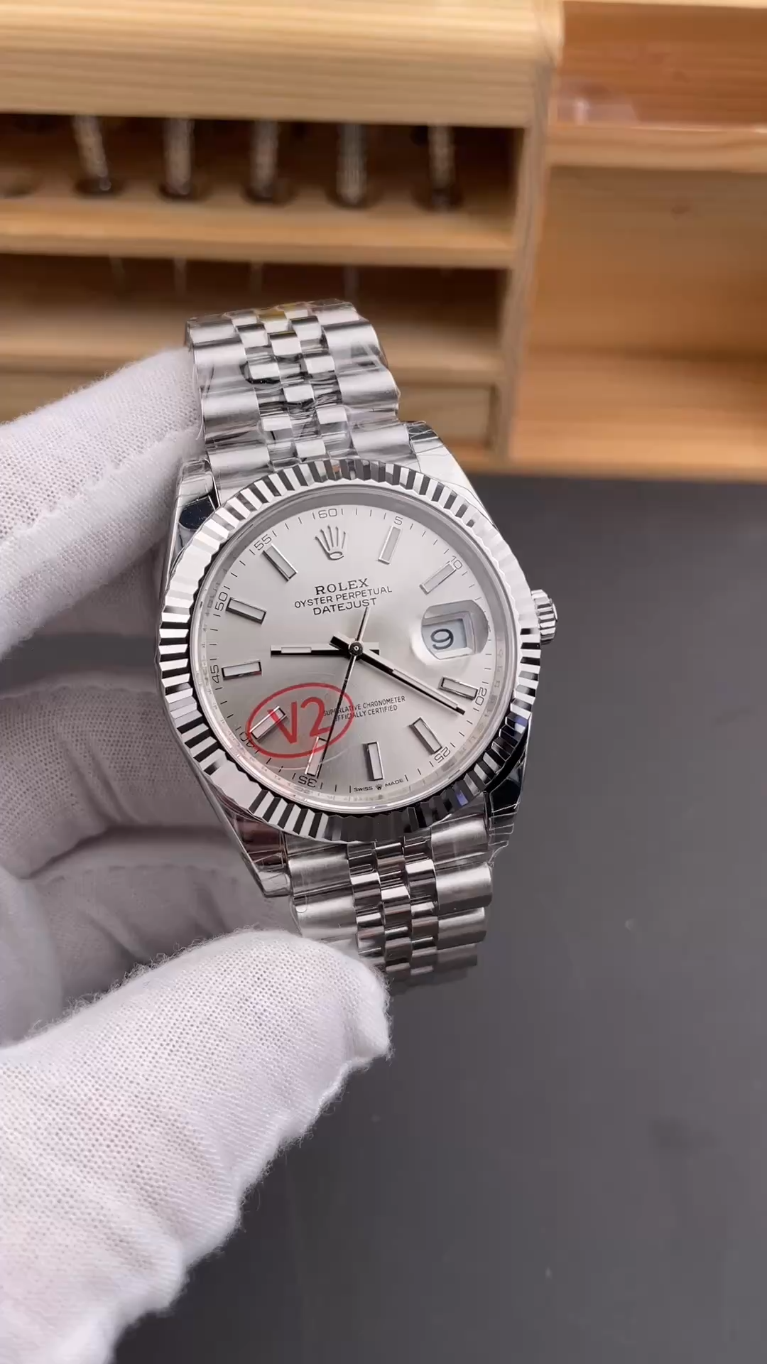Hand-held angled view of Rolex Datejust 41 126334-0004 showing the silver dial and Jubilee bracelet. - Video
