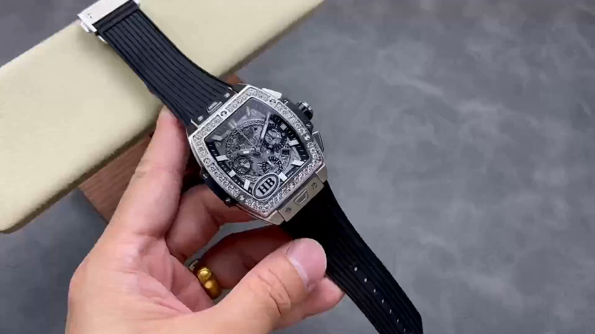 Strap in hand: Hublot Spirit of Big Bang 642.NX.0170.RX.1104 showing black rubber strap laid out. - Video