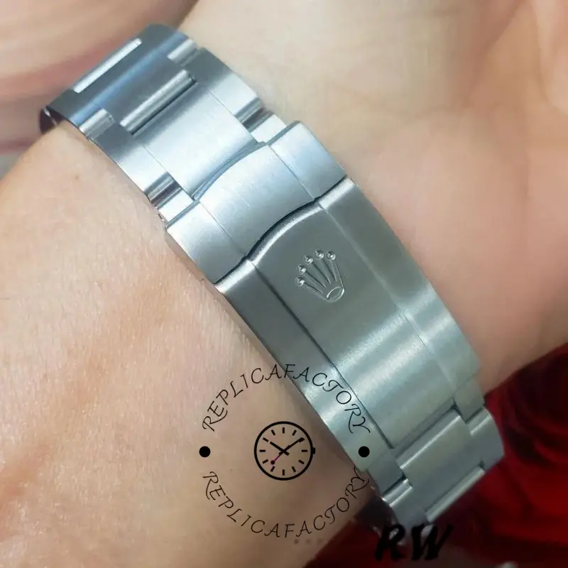 Rolex Oyster Perpetual Air-King 114200, bracelet clasp close-up on wrist, brushed finish.