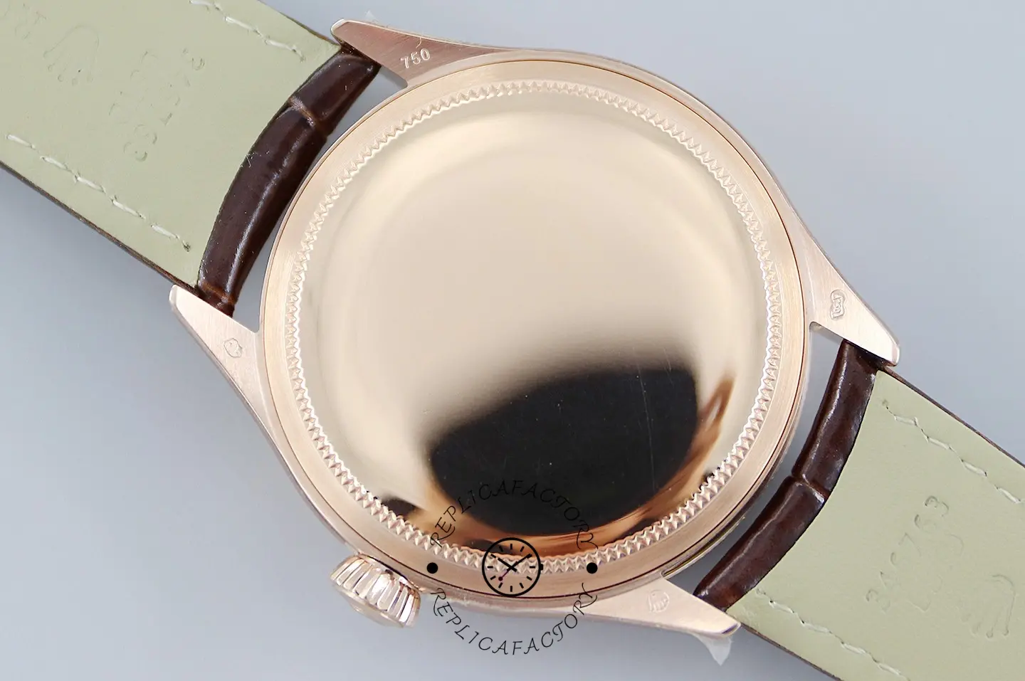 Rolex Cellini Date 50515 full caseback view, polished rose gold back with strap fitted.