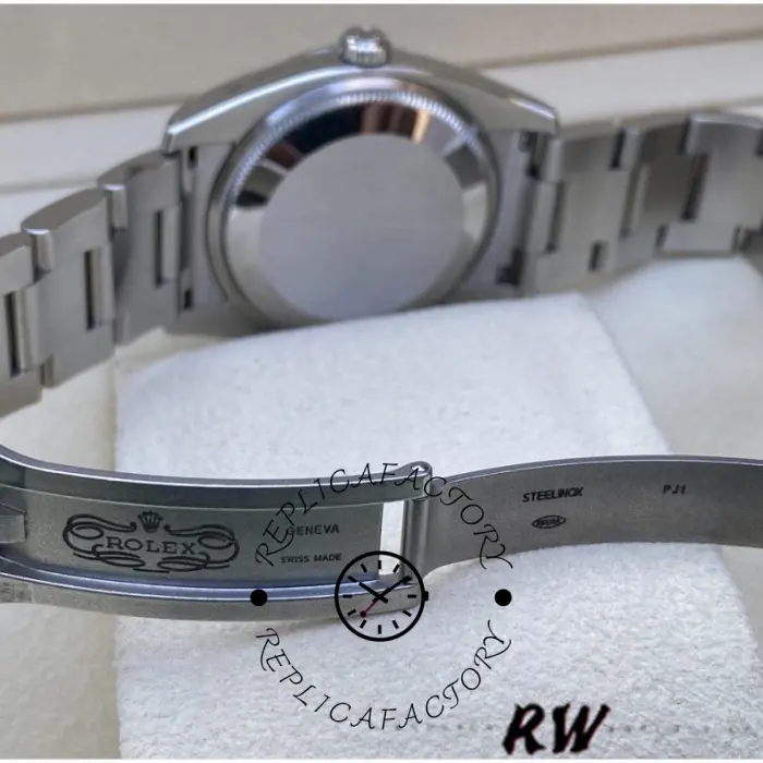 Rolex Air-King 114200 rear view on cushion, smooth case back and Oyster bracelet, side angle.
