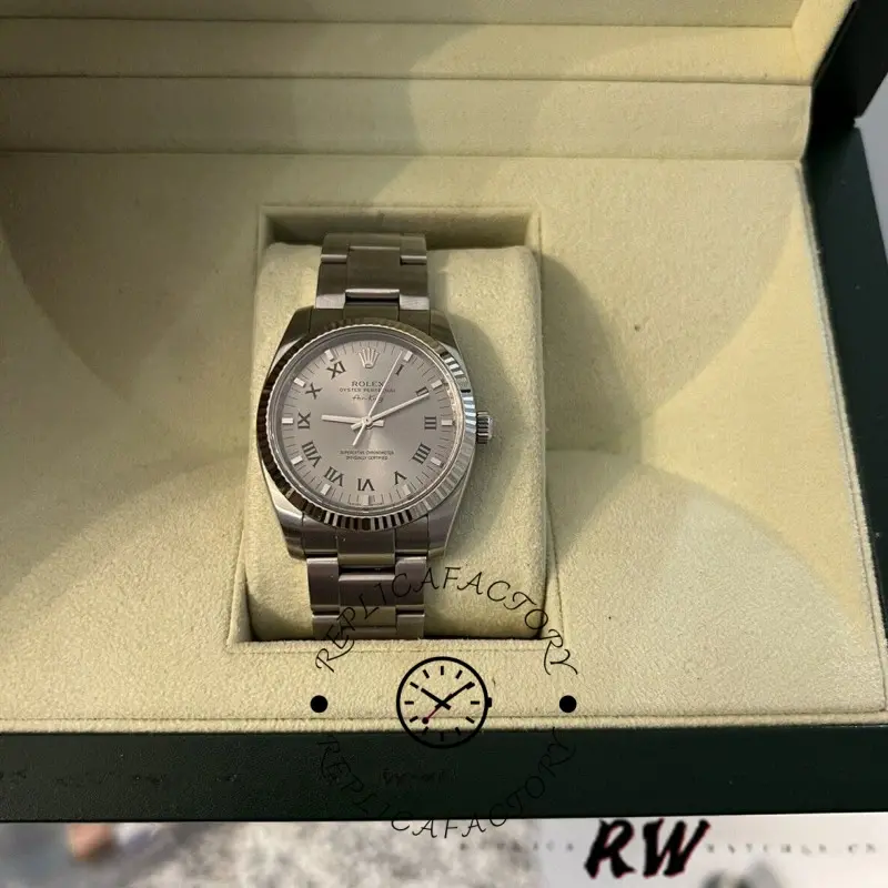 Rolex Air-King 114234 inside watch box, front view of silver dial and bracelet.