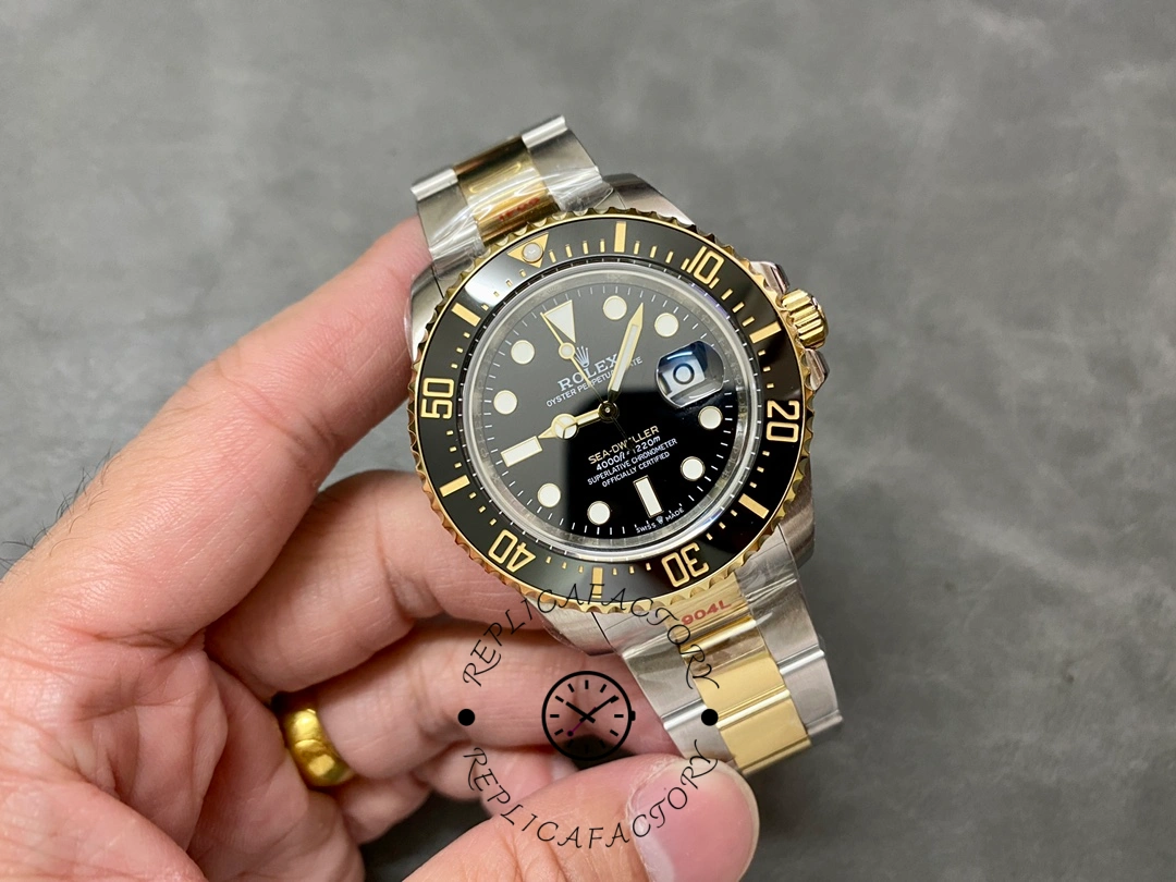 Rolex Sea-Dweller 126603 0001, full watch in hand showing two-tone Oyster bracelet.