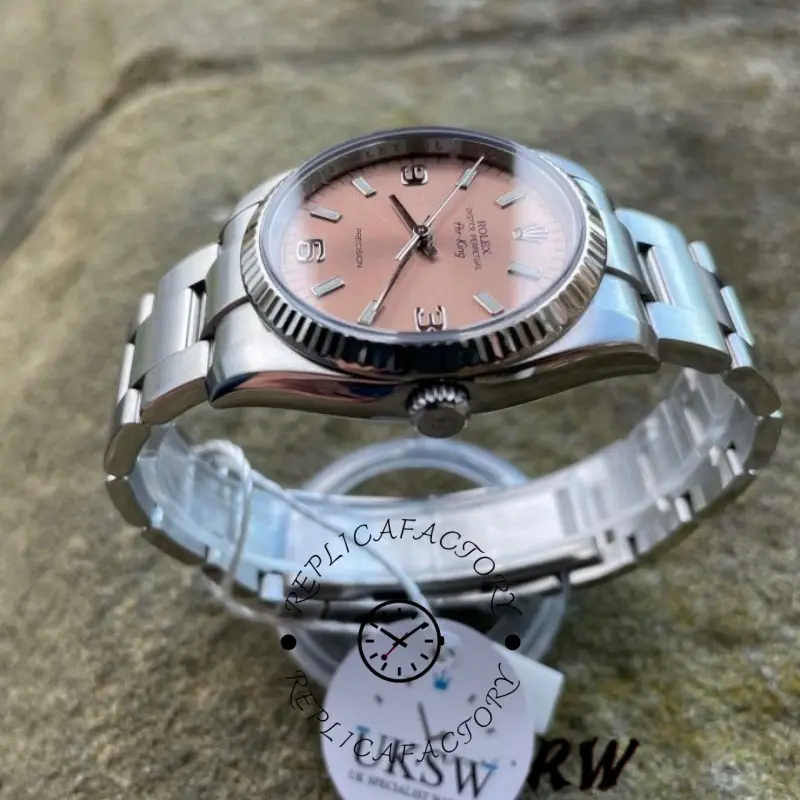 Rolex Oyster Perpetual Air-King 114234, case profile view showing crown and fluted bezel.