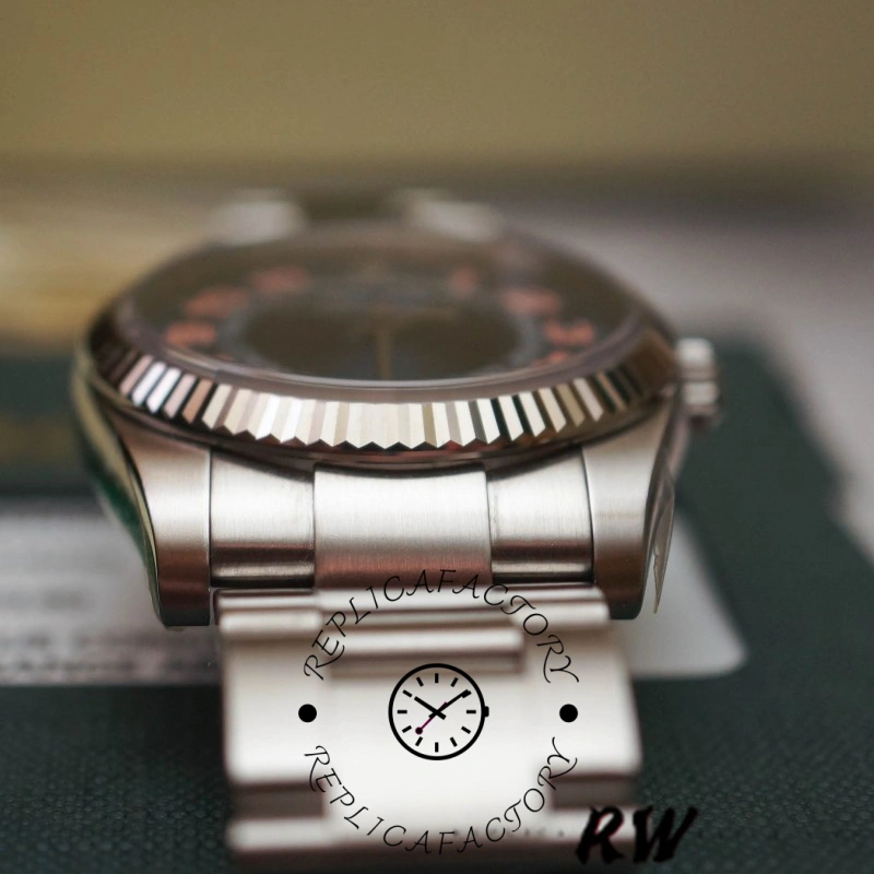 Rolex Air-King 114234, side profile showing fluted bezel and stainless steel case.