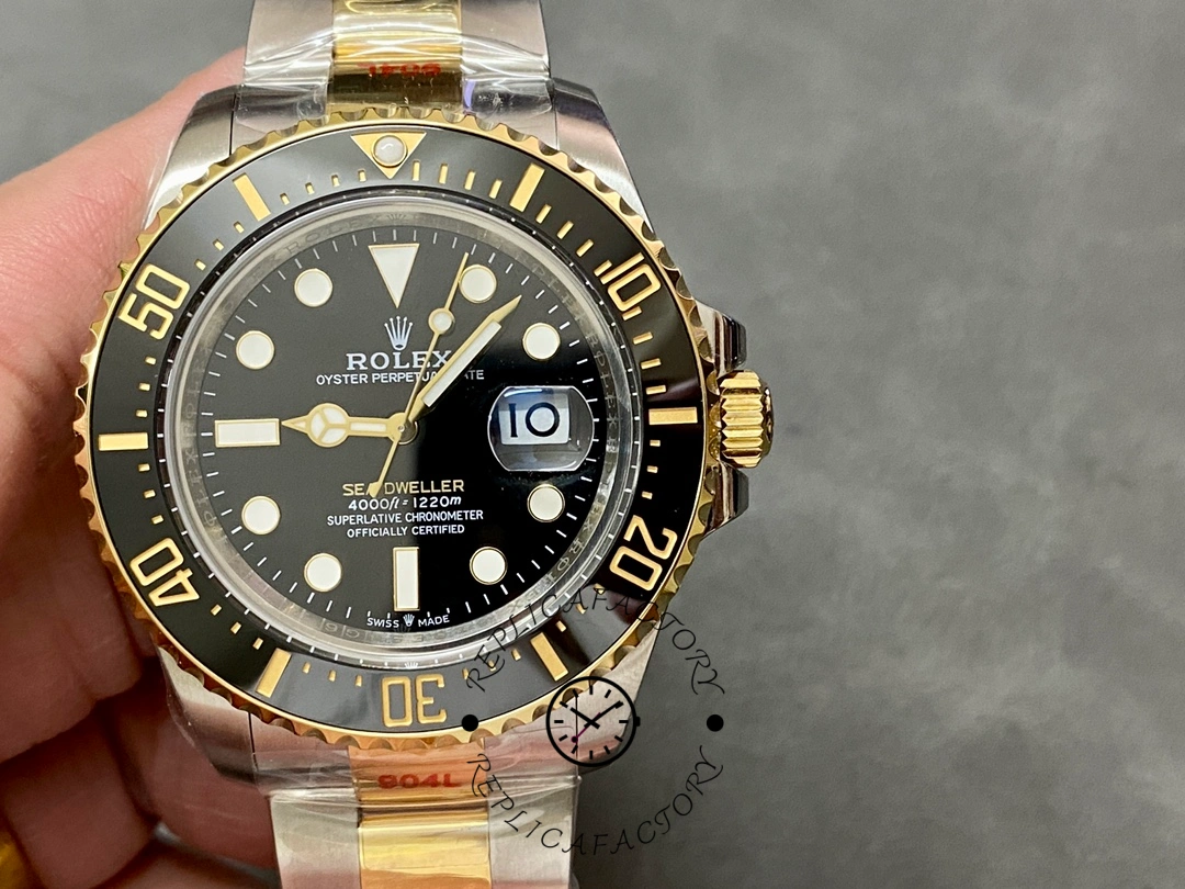 Rolex Sea-Dweller 126603 0001, front close-up showing black dial and gold bezel.