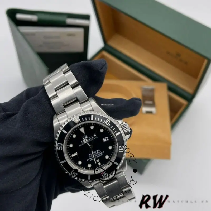 Rolex Sea-Dweller 4000 16600, display with box and accessories in background.