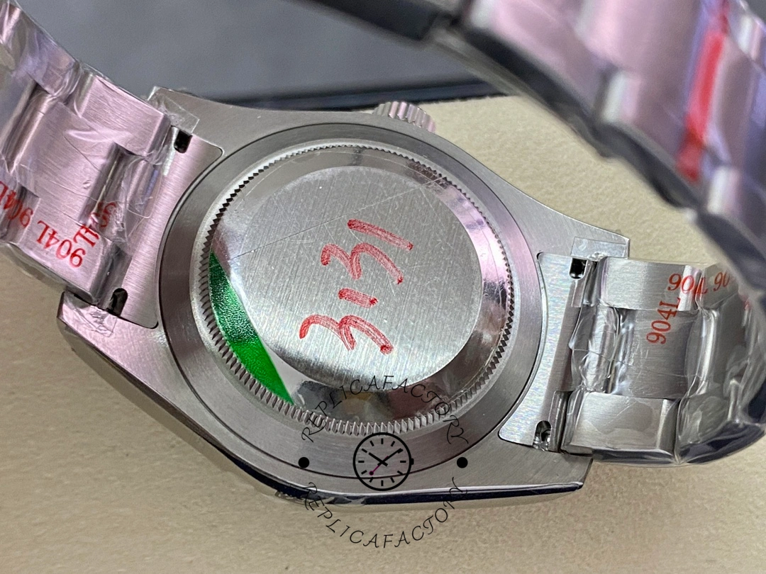 Rolex Air-King 116900, caseback close-up with protective sticker and engravings.