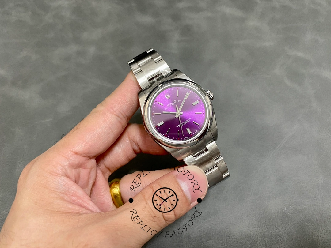 Rolex Oyster Perpetual Air-King 114200, side angle in hand showing case profile and bezel.