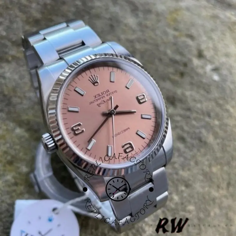 Rolex Oyster Perpetual Air-King 114234, pink dial close-up, angled view showing fluted bezel.