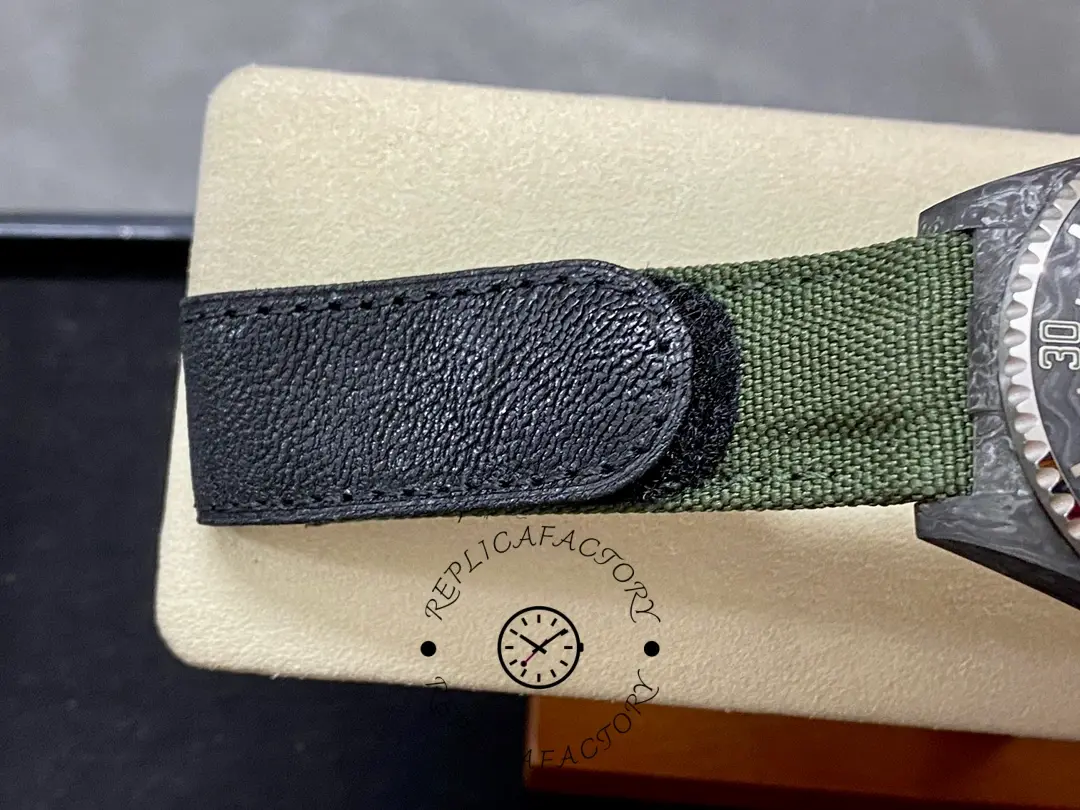 Rolex Sea-Dweller DiW Carbon HUNTER ARABIC strap detail, green fabric strap texture and stitching.
