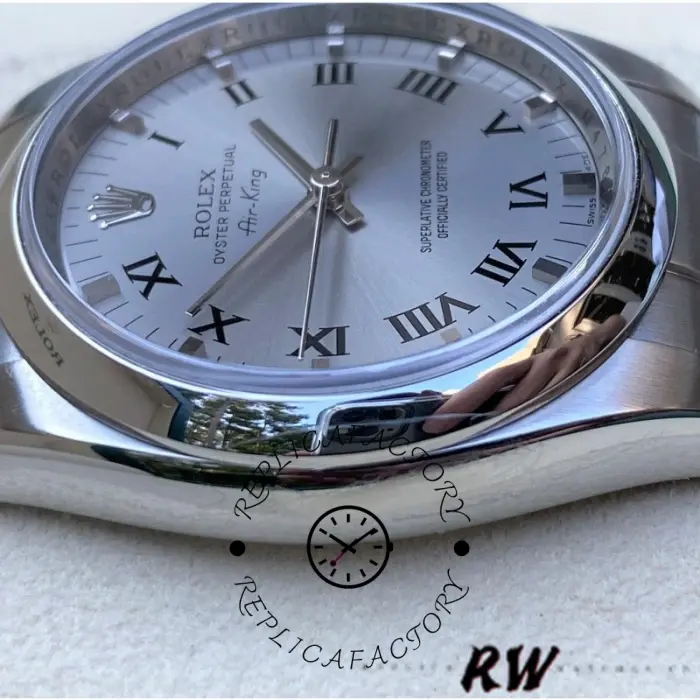 Rolex Air-King 114200 dial close-up, silver Roman numerals, smooth bezel and crystal detail.