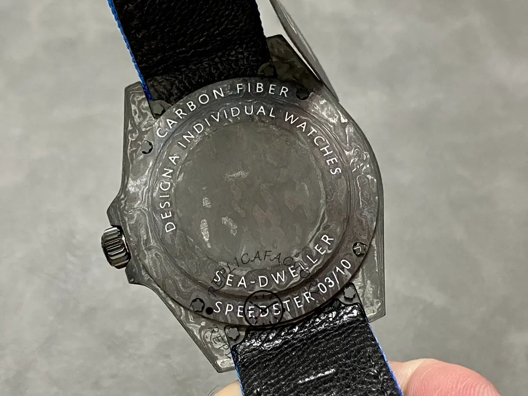 Rolex Sea-Dweller DiW Carbon Fiber, caseback view with engraved details.